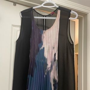 Silk sheer sleeveless blouse.